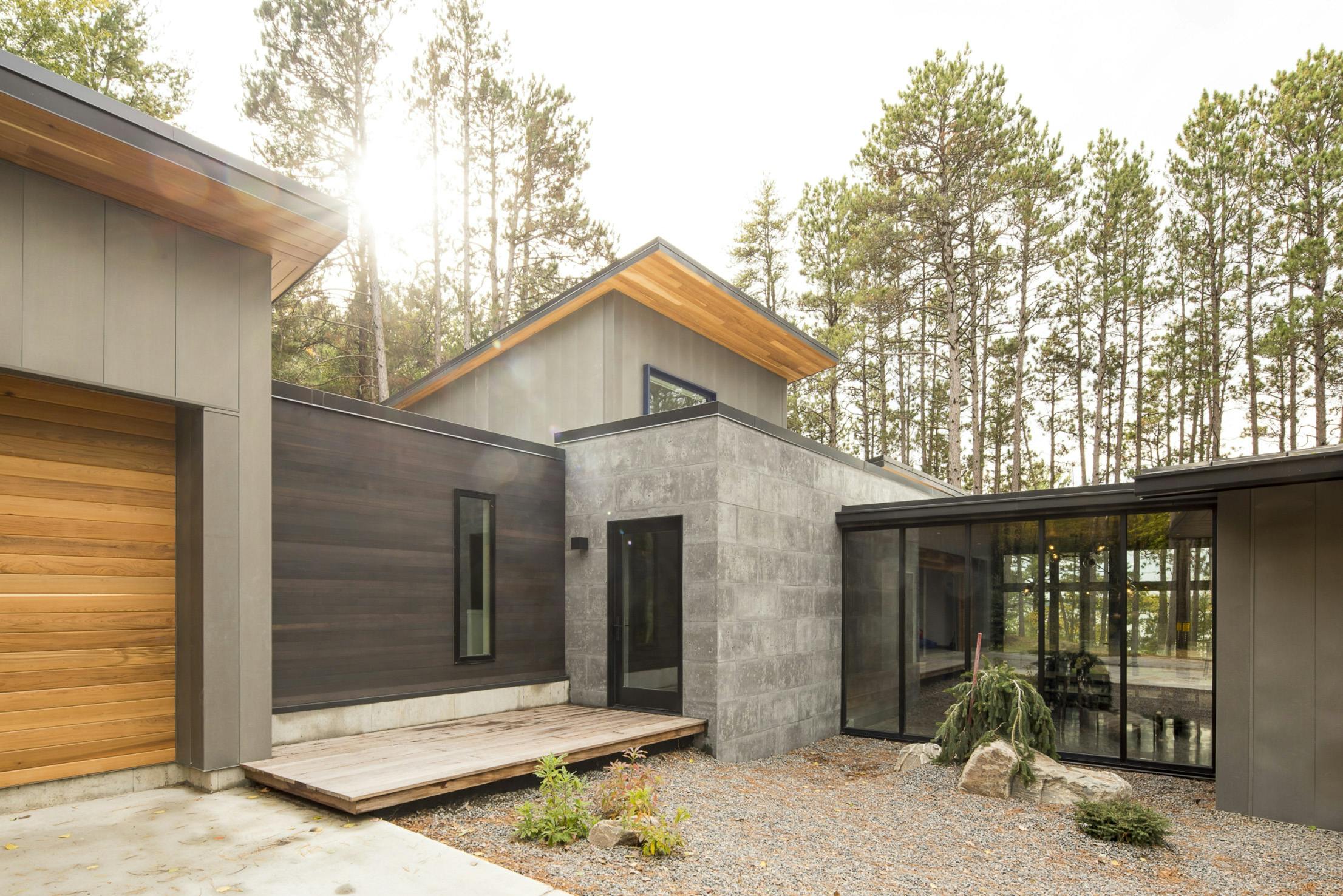 Inviting Lakeside 3-Season Porch with Folding Glass Door System